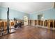 Exercise room featuring hardwood floors, recessed lights and access to other rooms at 5001 W Dickens Ave, Tampa, FL 33629