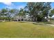 Spacious two-story home surrounded by mature trees on a sprawling lot at 5001 W Dickens Ave, Tampa, FL 33629