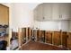 Kitchen with hardwood floors, subway tile backsplash, and modern cabinets at 5001 W Dickens Ave, Tampa, FL 33629