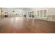 Spacious living room featuring hardwood floors, many windows, and sliding glass doors at 5001 W Dickens Ave, Tampa, FL 33629
