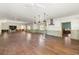 Open living room with hardwood floors, recessed lights and ceiling fans at 5001 W Dickens Ave, Tampa, FL 33629