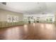 Large living room with hardwood flooring, recessed lighting, and neutral wall paint at 5001 W Dickens Ave, Tampa, FL 33629