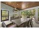 Outdoor dining area with custom grill, beautiful wood ceiling and tile backsplash at 5001 W Dickens Ave, Tampa, FL 33629