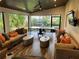 Inviting outdoor space with seating, a ping pong table, and lush landscaping at 5001 W Dickens Ave, Tampa, FL 33629
