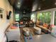 Entertainment patio with lounge area, outdoor kitchen, and a ping pong table for fun gatherings at 5001 W Dickens Ave, Tampa, FL 33629