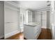 Spacious walk-in closet with custom shelving, center island, and natural light at 5001 W Dickens Ave, Tampa, FL 33629