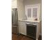 Elegant wet bar featuring stainless steel refrigerator, wine cooler, and sleek countertops at 5001 W Dickens Ave, Tampa, FL 33629