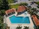 An aerial view of the community pool, cabanas, and jacuzzi at this community at 502 Hammock Pine Blvd # 502, Clearwater, FL 33761