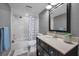 Updated bathroom with a modern vanity, framed mirror, and shower-tub combination at 502 Hammock Pine Blvd # 502, Clearwater, FL 33761