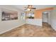 Dining area with tile floors, white wainscoting, and pass-through to the kitchen at 502 Hammock Pine Blvd # 502, Clearwater, FL 33761