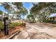 Gated entrance with meticulously maintained landscaping providing privacy and curb appeal at 502 Hammock Pine Blvd # 502, Clearwater, FL 33761