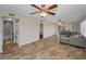 Spacious living room with tile flooring, ceiling fans, and views of the exterior at 502 Hammock Pine Blvd # 502, Clearwater, FL 33761