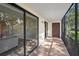 View from the screened patio showing the interior living area and outdoor space at 502 Hammock Pine Blvd # 502, Clearwater, FL 33761
