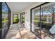 Inviting screened patio with tile floors and natural light; great for outdoor seating at 502 Hammock Pine Blvd # 502, Clearwater, FL 33761