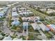 Aerial view of a colorful neighborhood showcasing the homes, lush landscaping, and roadways at 531 Bimini Bay Blvd, Apollo Beach, FL 33572