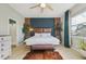 Bright bedroom featuring a king bed, ceiling fan, and tile floors at 531 Bimini Bay Blvd, Apollo Beach, FL 33572