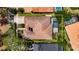 Detailed aerial view highlights the home, its pool, and lush landscaping in a peaceful neighborhood setting at 5316 Candler View Dr, Lithia, FL 33547