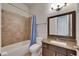 Bathroom with granite counters, a bath-shower, and a modern fixture at 5316 Candler View Dr, Lithia, FL 33547