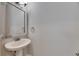 Half bathroom featuring a pedestal sink and a decorative mirror at 5316 Candler View Dr, Lithia, FL 33547