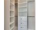 Walk-in closet with custom shelves, drawers, and rods maximizing storage and organization at 5316 Candler View Dr, Lithia, FL 33547