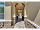 Inviting entryway with stone accents and an elegant pendant light fixture creates a grand first impression at 5316 Candler View Dr, Lithia, FL 33547