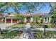 Charming single-Gathering home with a well-manicured lawn, paver walkway, and a two-car garage at 5316 Candler View Dr, Lithia, FL 33547
