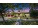Charming single-story home featuring a red tile roof, well-manicured lawn, and a welcoming two-car garage at 5316 Candler View Dr, Lithia, FL 33547