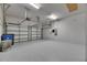 Spacious two car garage with durable flooring and automatic doors, perfect for parking and storage at 5316 Candler View Dr, Lithia, FL 33547