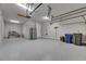Two car garage with durable flooring and ample storage space with shelving units at 5316 Candler View Dr, Lithia, FL 33547