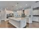 Beautiful kitchen with large center island, stainless appliances, stylish backsplash and hardwood flooring at 5316 Candler View Dr, Lithia, FL 33547