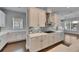 Modern kitchen features white cabinets, stainless steel hood, herringbone backsplash, and quartz countertops at 5316 Candler View Dr, Lithia, FL 33547