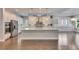 Gourmet kitchen featuring a large island, stainless steel appliances, and custom cabinetry with granite countertops at 5316 Candler View Dr, Lithia, FL 33547