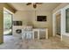 Lanai with a built-in kitchen featuring stainless steel appliances, travertine tile floor, and plenty of counter space at 5316 Candler View Dr, Lithia, FL 33547
