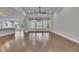 Spacious living room with hardwood flooring, tray ceiling and ample natural light pouring in from the backyard at 5316 Candler View Dr, Lithia, FL 33547
