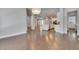 Spacious open-concept living and dining area with hardwood floors and neutral wall colors at 5316 Candler View Dr, Lithia, FL 33547