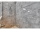 Close-up of a modern shower with grey tile and rainfall showerhead at 5316 Candler View Dr, Lithia, FL 33547