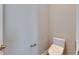 Clean, well-lit powder room featuring a modern toilet and neutral decor at 5316 Candler View Dr, Lithia, FL 33547