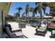Beautiful backyard patio area with waterfront views and lush landscaping at 600 Eleuthera Dr, Punta Gorda, FL 33950