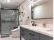 Modern bathroom featuring double sinks, sleek fixtures, and a frameless glass shower at 600 Eleuthera Dr, Punta Gorda, FL 33950