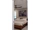 Comfortable bedroom with modern furnishings, ceiling fan, and natural light at 600 Eleuthera Dr, Punta Gorda, FL 33950