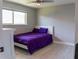 Cozy bedroom with a bright window, ceiling fan, and modern flooring at 600 Eleuthera Dr, Punta Gorda, FL 33950