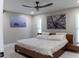 Well-lit bedroom featuring modern decor, ceiling fan, and tranquil ambiance at 600 Eleuthera Dr, Punta Gorda, FL 33950