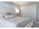 Bedroom featuring a comfortable bed, large window, and closet with sliding doors at 600 Eleuthera Dr, Punta Gorda, FL 33950
