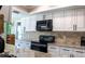 Stylish kitchen featuring white cabinets, granite countertops, and stainless steel appliances at 600 Eleuthera Dr, Punta Gorda, FL 33950