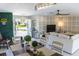 Open-concept living room showcases modern design, natural light, and a unique decor at 600 Eleuthera Dr, Punta Gorda, FL 33950