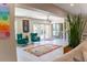 Spacious living room featuring chic decor, colorful rug, and an abundance of natural light at 600 Eleuthera Dr, Punta Gorda, FL 33950