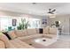 Spacious living room with a large sectional couch and open floor plan at 600 Eleuthera Dr, Punta Gorda, FL 33950