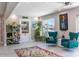 Bright living room with stylish decor, ceiling fan, and plenty of space at 600 Eleuthera Dr, Punta Gorda, FL 33950