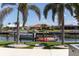 Breathtaking waterfront view featuring palm trees and boat docks at 600 Eleuthera Dr, Punta Gorda, FL 33950