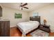 Bedroom featuring a bed with a patterned comforter, ceiling fan, and natural light from a window at 6001 19Th Ne St, St Petersburg, FL 33703